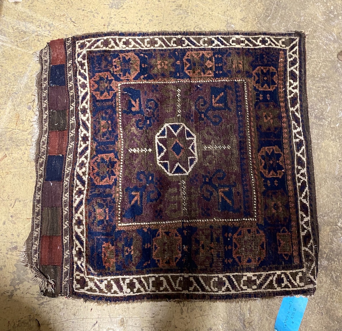 An antique Belouch saddlebag rug, 183 x 84cm and a single bagface, 78 x 76cm